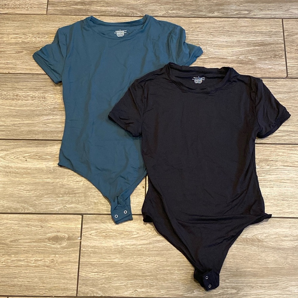 Pair Of Suuksess Medium Bodysuits